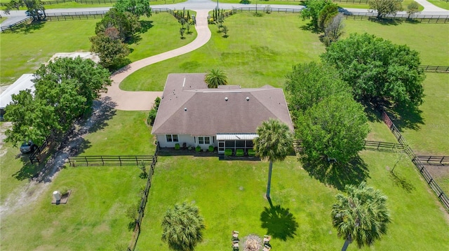 birds eye view of property with a rural view