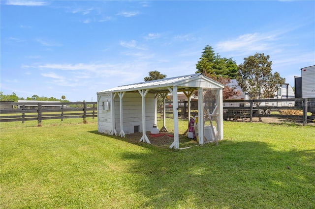 view of poultry coop with fence and a lawn
