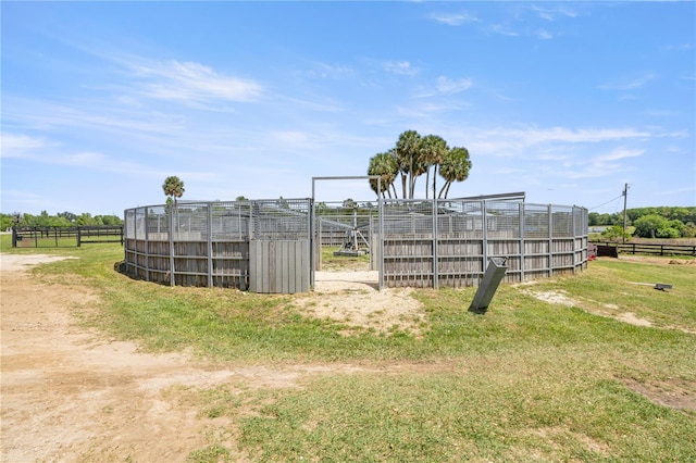 exterior space featuring an outbuilding and fence
