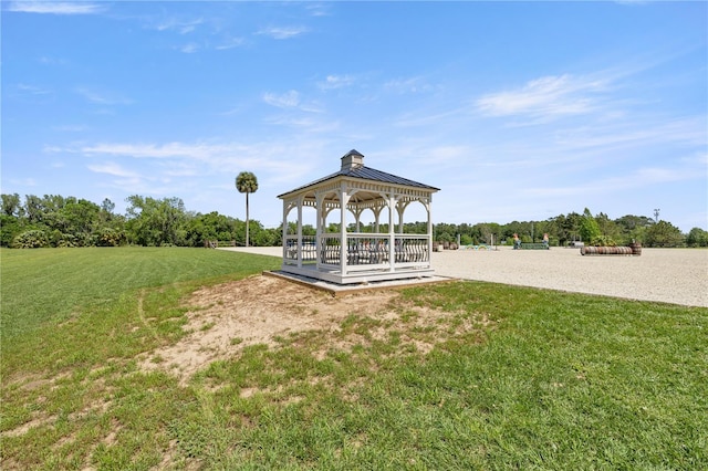 view of property's community featuring a yard and a gazebo