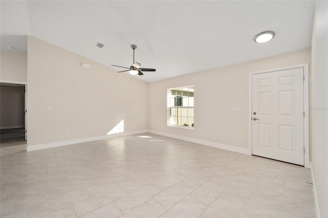 unfurnished living room featuring visible vents, baseboards, and ceiling fan