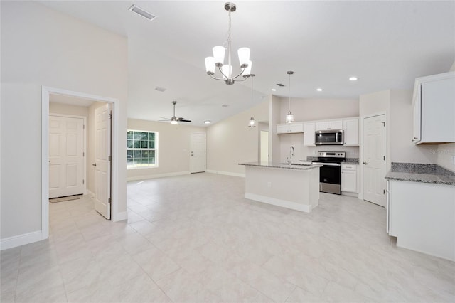 kitchen featuring vaulted ceiling, a sink, appliances with stainless steel finishes, open floor plan, and ceiling fan with notable chandelier