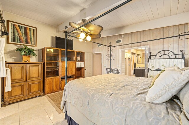 31 SE Chinica Dr, Summerfield, FL 34491 - bedroom featuring light tile patterned floors, a wooden ceiling with exposed beams, and wooden walls