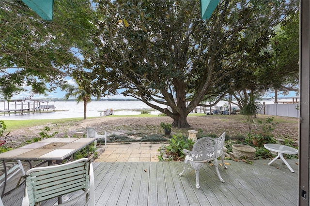 31 SE Chinica Dr, Summerfield, FL 34491 - deck featuring a water view and outdoor dining space