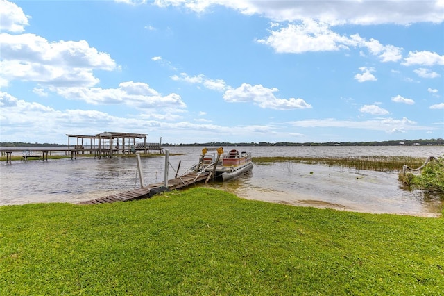 31 SE Chinica Dr, Summerfield, FL 34491 - dock area with a water view and a yard