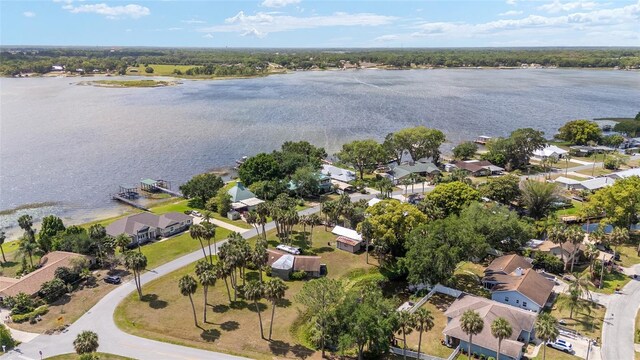 31 SE Chinica Dr, Summerfield, FL 34491 - aerial view of property's location with a large body of water and nearby suburban area