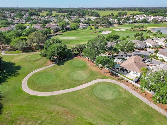 birds eye view of property with a water view, view of golf course, and a residential view