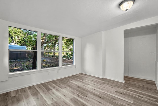 935 NE Sanchez Ave, Ocala, FL 34470 - spare room featuring baseboards and wood finished floors