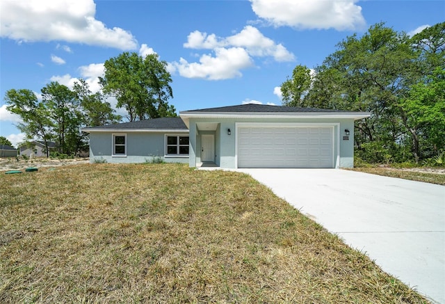 10435 SE 125th Ln, Belleview, FL 34420 - single story home with concrete driveway, stucco siding, a front lawn, and an attached garage