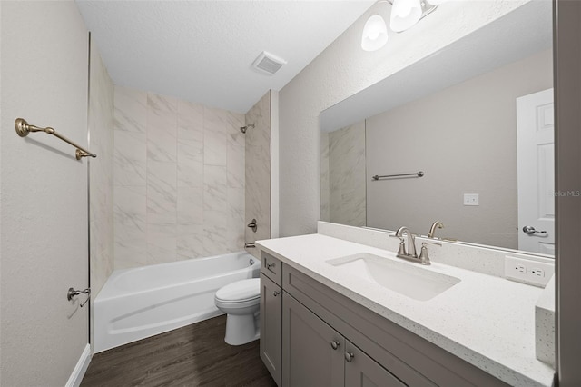 10435 SE 125th Ln, Belleview, FL 34420 - bathroom featuring toilet, wood finished floors, shower / tub combination, visible vents, and vanity