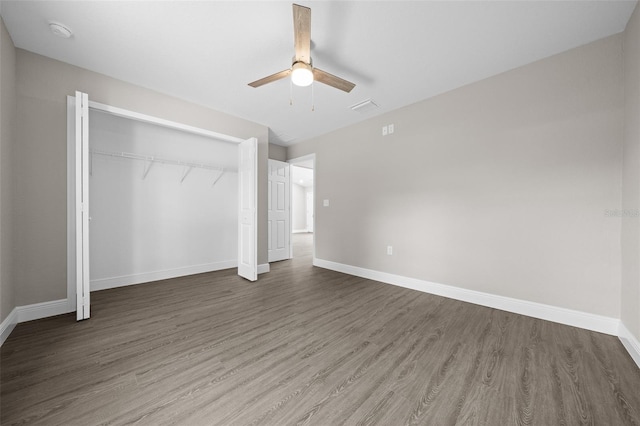 10435 SE 125th Ln, Belleview, FL 34420 - unfurnished bedroom with wood finished floors, a closet, visible vents, baseboards, and ceiling fan