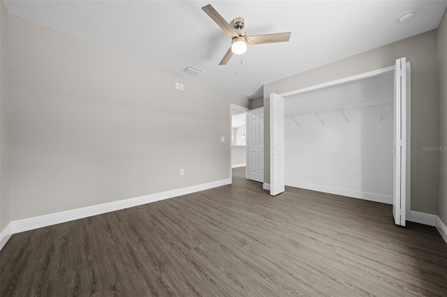 10435 SE 125th Ln, Belleview, FL 34420 - unfurnished bedroom with baseboards, a closet, visible vents, and wood finished floors