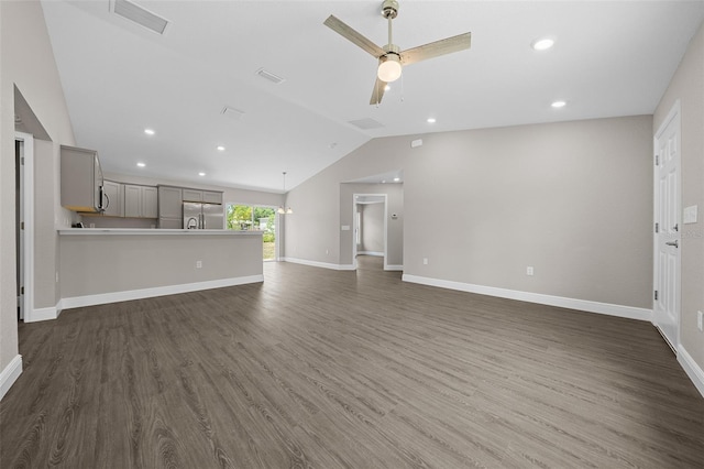 10435 SE 125th Ln, Belleview, FL 34420 - unfurnished living room with lofted ceiling, ceiling fan, visible vents, and dark wood-style floors
