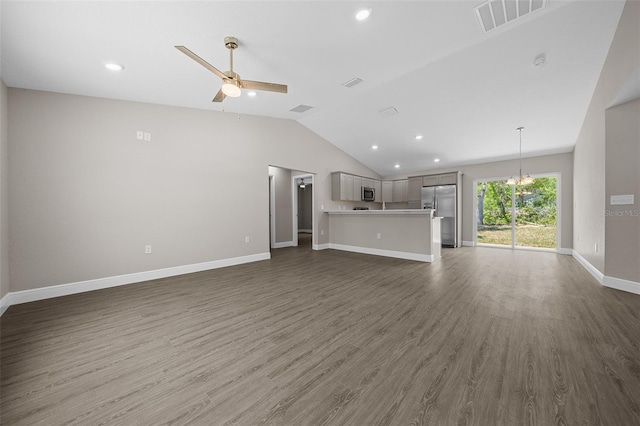 10435 SE 125th Ln, Belleview, FL 34420 - unfurnished living room with a ceiling fan, dark wood finished floors, visible vents, vaulted ceiling, and recessed lighting