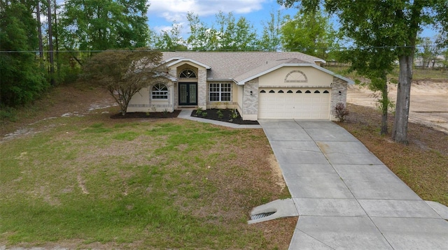 view of front of home with roof with shingles, a front lawn, an attached garage, french doors, and driveway