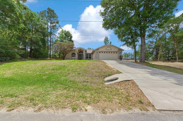 view of front of property with a garage, driveway, and a front lawn