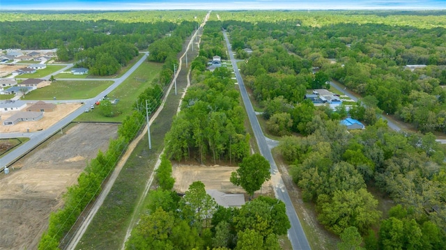 bird's eye view featuring a forest view