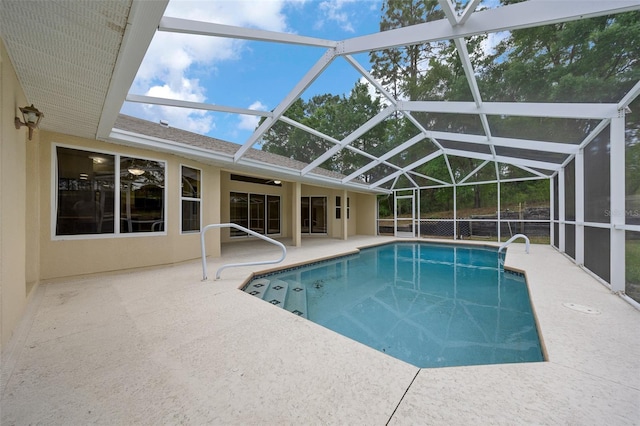 pool with a patio and a lanai
