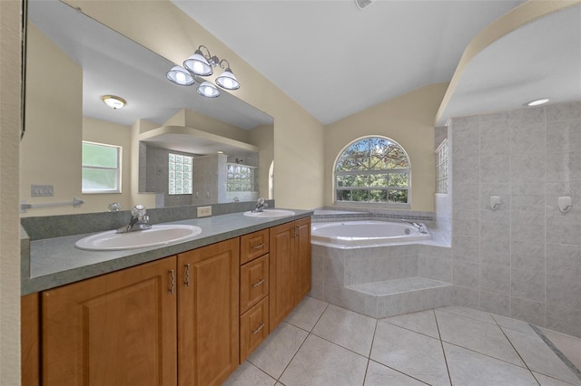 full bath with a sink, a bath, a tile shower, and tile patterned flooring