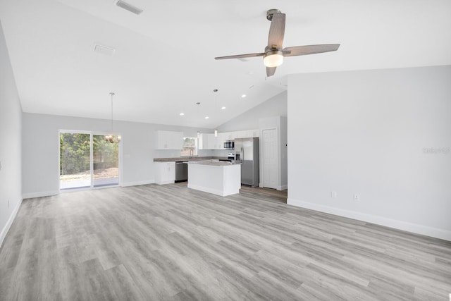 unfurnished living room with baseboards, light wood-style floors, visible vents, and ceiling fan with notable chandelier