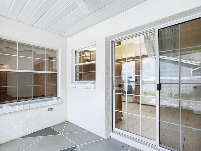 doorway to property with stucco siding