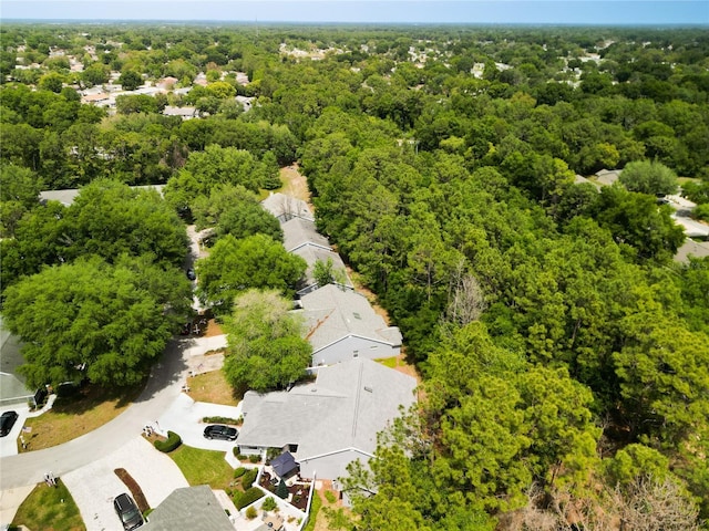 aerial view featuring a view of trees and a residential view