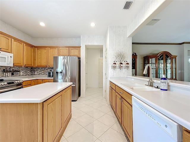 kitchen with a sink, visible vents, light countertops, and appliances with stainless steel finishes