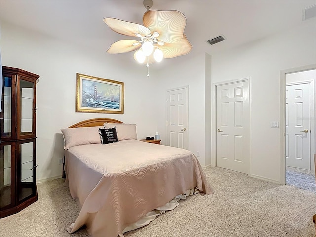bedroom featuring a ceiling fan, baseboards, carpet, and visible vents