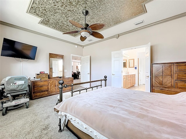 bedroom with visible vents, ceiling fan, crown molding, connected bathroom, and carpet flooring