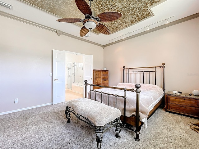 carpeted bedroom featuring baseboards, ornamental molding, ensuite bathroom, visible vents, and ceiling fan