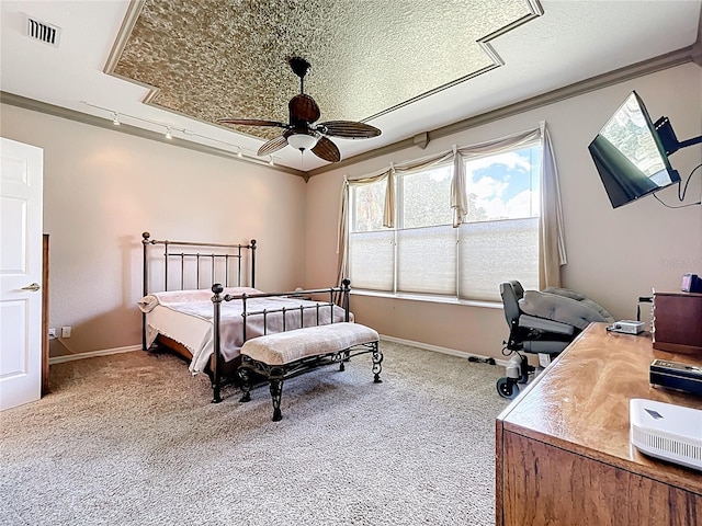 bedroom featuring visible vents, baseboards, ornamental molding, ceiling fan, and carpet flooring
