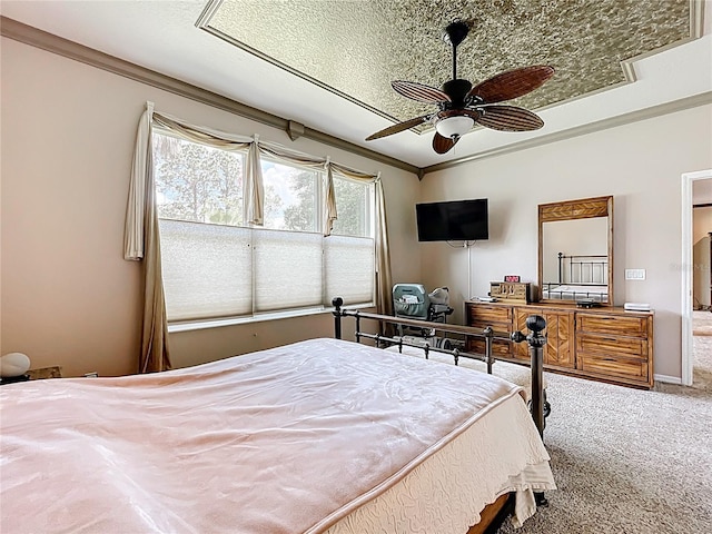 bedroom with ornamental molding and carpet floors