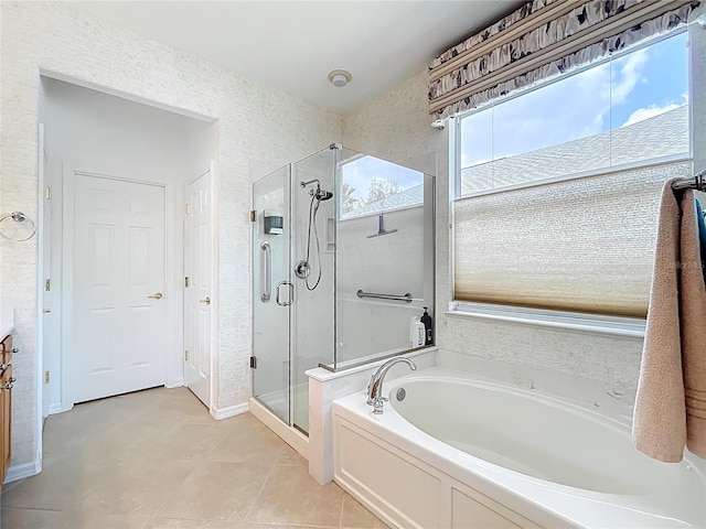 bathroom with a bath, tile patterned flooring, and a stall shower
