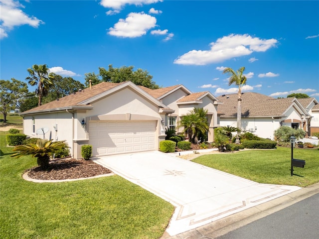 ranch-style home featuring a garage, a front yard, driveway, and stucco siding