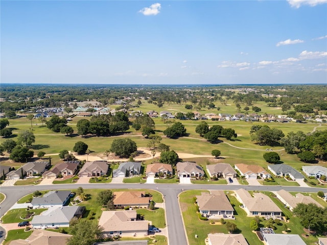 bird's eye view with view of golf course and a residential view