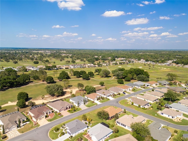 aerial view with a residential view and view of golf course