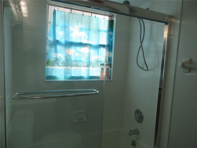full bath with combined bath / shower with glass door