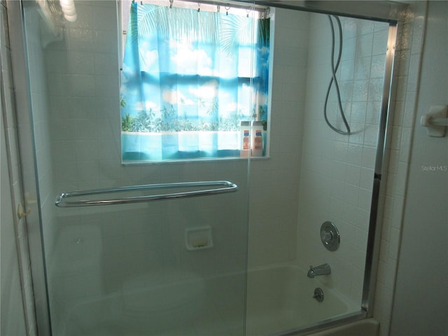full bath with combined bath / shower with glass door