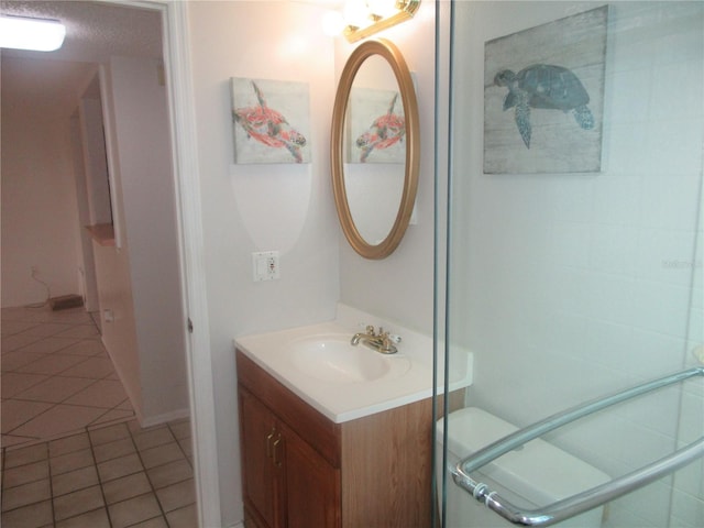 bathroom featuring tile patterned flooring and vanity