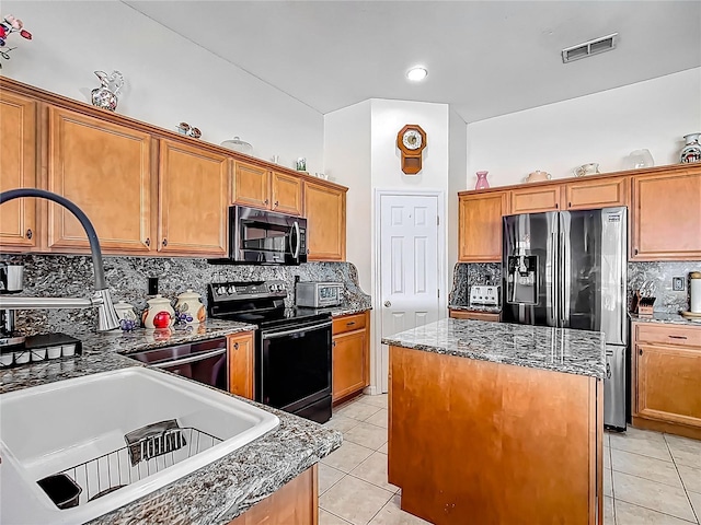 4033 NE 15th Court Rd, Ocala, FL 34479 - kitchen featuring black appliances, decorative backsplash, a kitchen island, and light tile patterned flooring