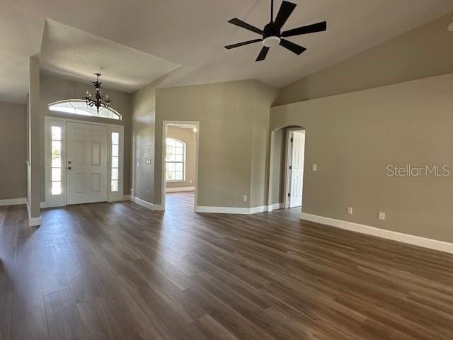 9934 SE 64th Ave, Belleview, FL 34420 - entrance foyer with arched walkways, dark wood-style flooring, and baseboards