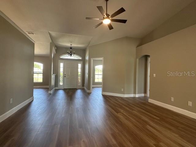 9934 SE 64th Ave, Belleview, FL 34420 - entryway with dark wood-type flooring, baseboards, arched walkways, and ceiling fan with notable chandelier
