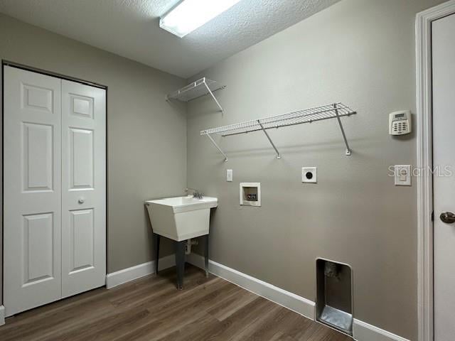 9934 SE 64th Ave, Belleview, FL 34420 - laundry area featuring hookup for an electric dryer, baseboards, washer hookup, laundry area, and dark wood finished floors