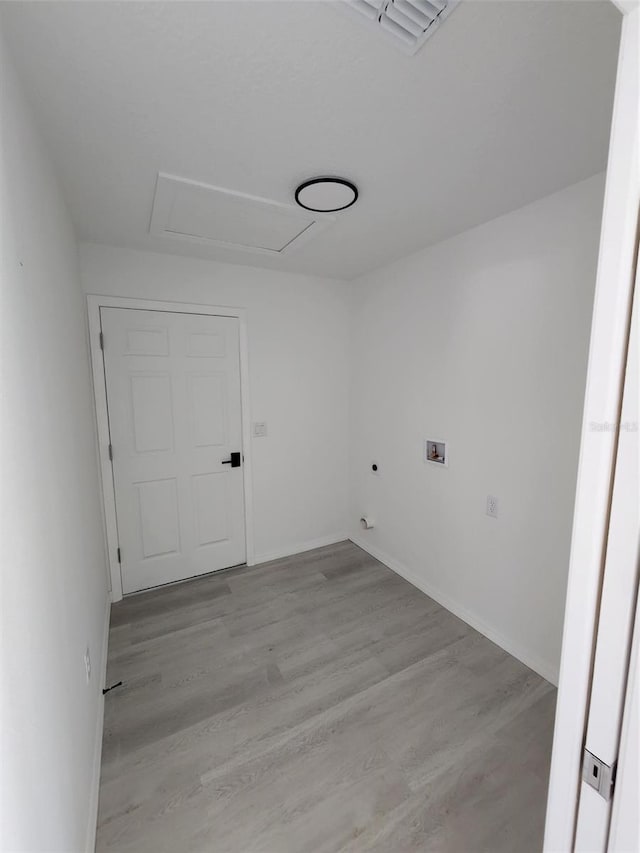 22764 SW Sea Cliff Ave, Dunnellon, FL 34431 - laundry room with light wood finished floors, baseboards, and washer hookup