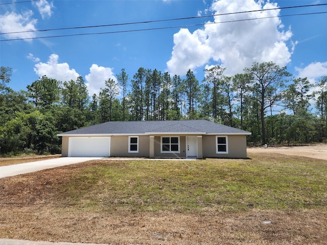 22764 SW Sea Cliff Ave, Dunnellon, FL 34431 - ranch-style house with driveway, a front lawn, an attached garage, and stucco siding