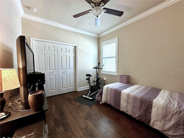 3488 NW 26th St, Gainesville, FL 32605 - bedroom with baseboards, a closet, crown molding, ceiling fan, and wood finished floors