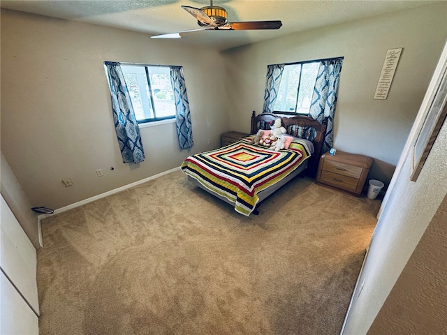 carpeted bedroom featuring a ceiling fan