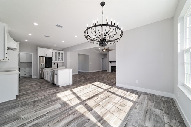 14115 NW 141st Ave, Williston, FL 32696 - kitchen featuring appliances with stainless steel finishes, open floor plan, light countertops, wood finished floors, and recessed lighting
