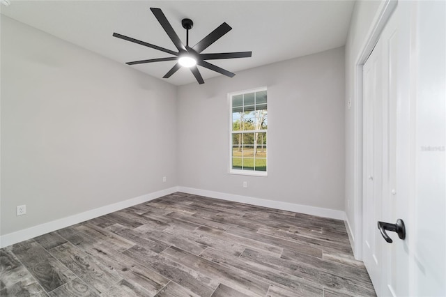 14115 NW 141st Ave, Williston, FL 32696 - unfurnished bedroom featuring a closet, wood finished floors, baseboards, and a ceiling fan