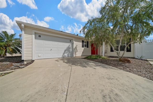 882 Tanglewood Pl, The Villages, FL 32162 - ranch-style home with an attached garage, fence, and concrete driveway